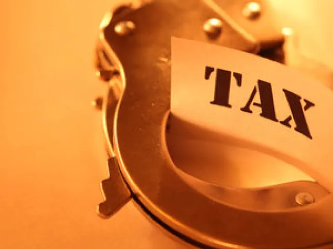 Taxes and handcuffs